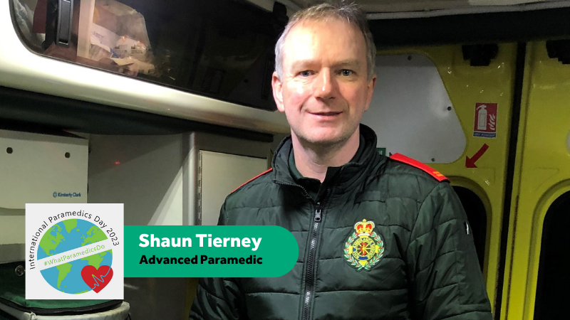 Advanced paramedic Shaun Tierney stood inside ambulance in uniform